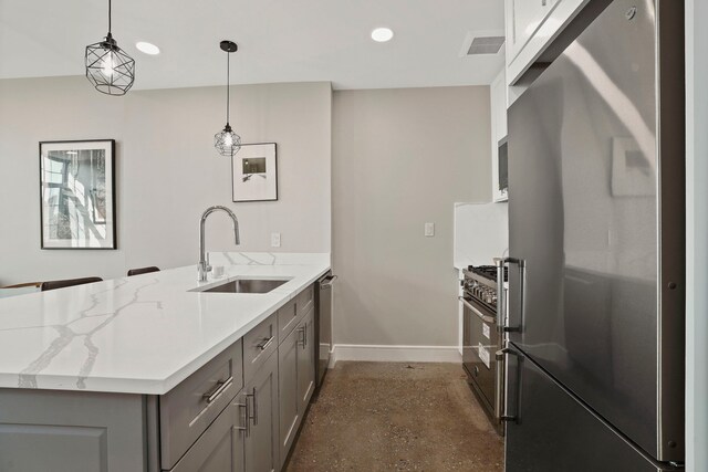 kitchen with stainless steel fridge, white cabinets, a kitchen bar, hanging light fixtures, and a center island