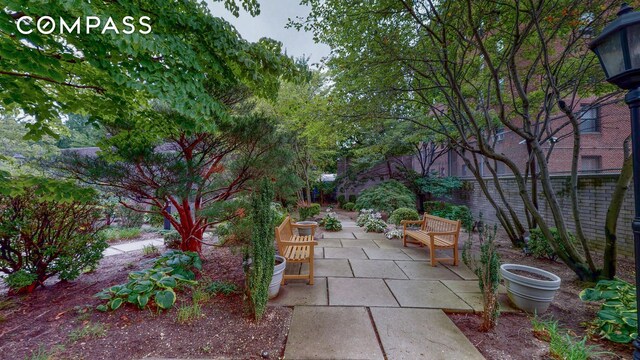 exterior space with a patio area and a fenced backyard