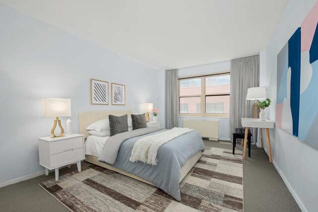 bedroom with carpet and baseboards