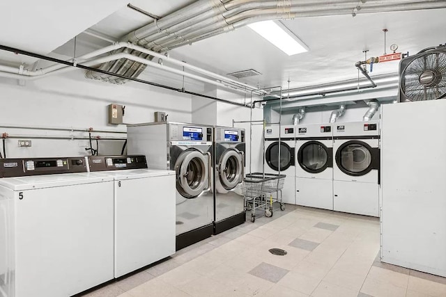 shared laundry area featuring washing machine and clothes dryer