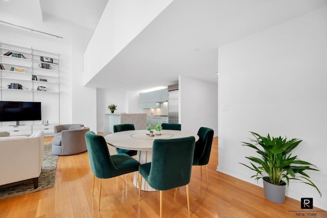 dining space featuring light wood-type flooring