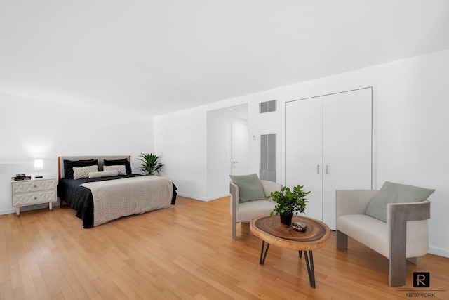 310 E 53rd St Unit 2/3C, New York City, NY 10022 - bedroom with light wood-type flooring, baseboards, and a closet