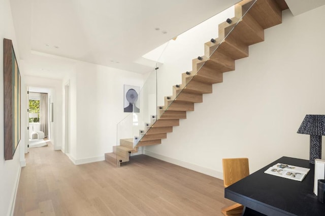 stairway featuring hardwood / wood-style floors