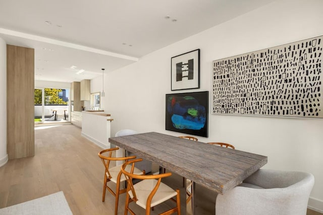 dining room with light wood-type flooring