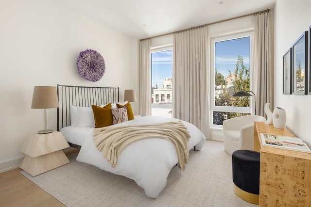 bedroom with light hardwood / wood-style floors