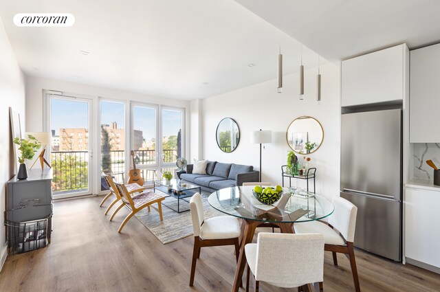 dining area with light hardwood / wood-style floors