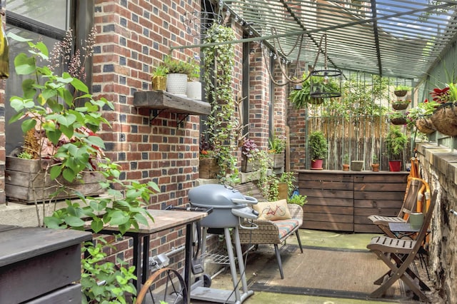 view of patio featuring grilling area and fence