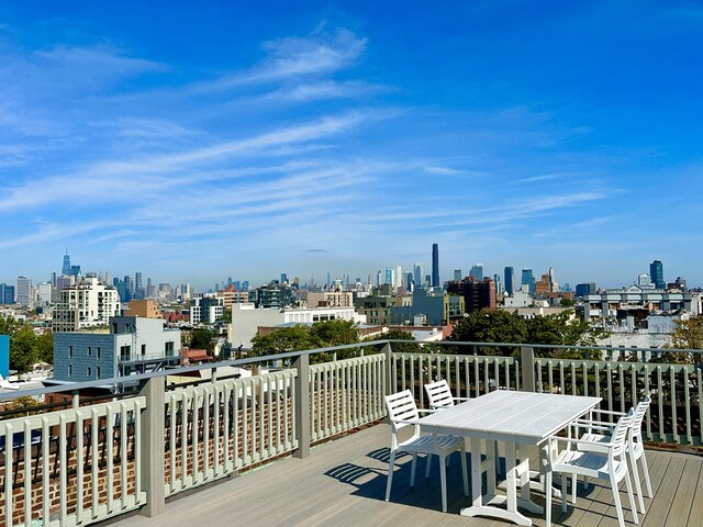 wooden deck featuring a view of city