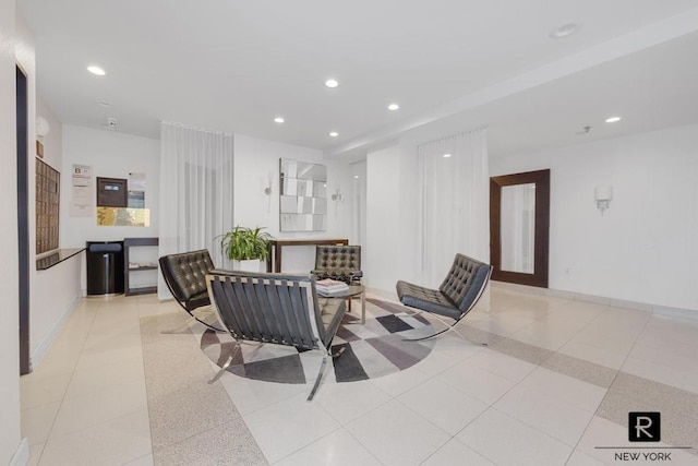 dining space featuring light tile patterned flooring, recessed lighting, and baseboards