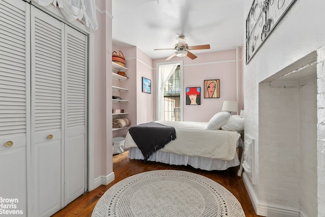 bedroom featuring wood finished floors, a closet, and ceiling fan