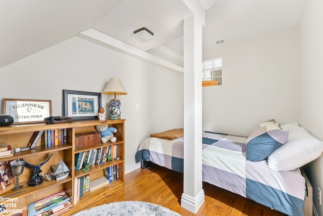 bedroom featuring wood finished floors