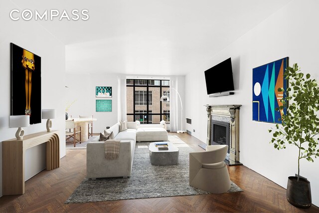 living room with parquet flooring, floor to ceiling windows, and a high end fireplace