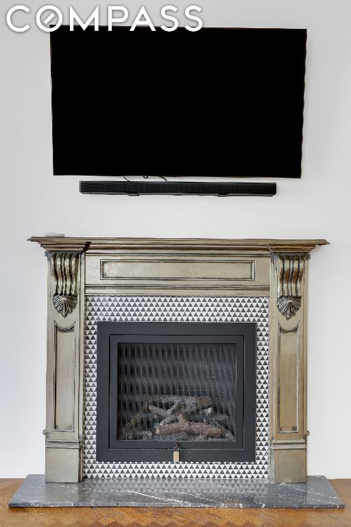 details featuring a tile fireplace