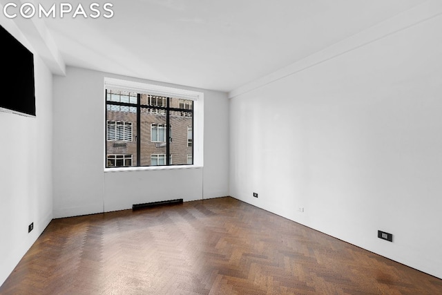 empty room featuring dark parquet floors