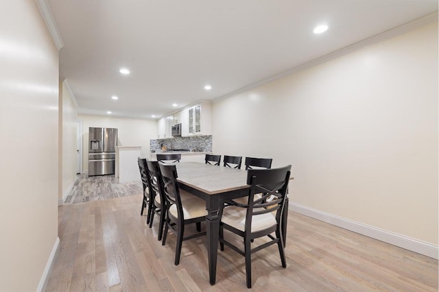 unfurnished bedroom featuring crown molding, ceiling fan, and light hardwood / wood-style floors