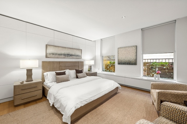 bedroom with light wood finished floors