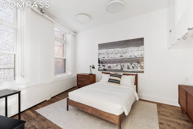 bedroom featuring dark wood-type flooring