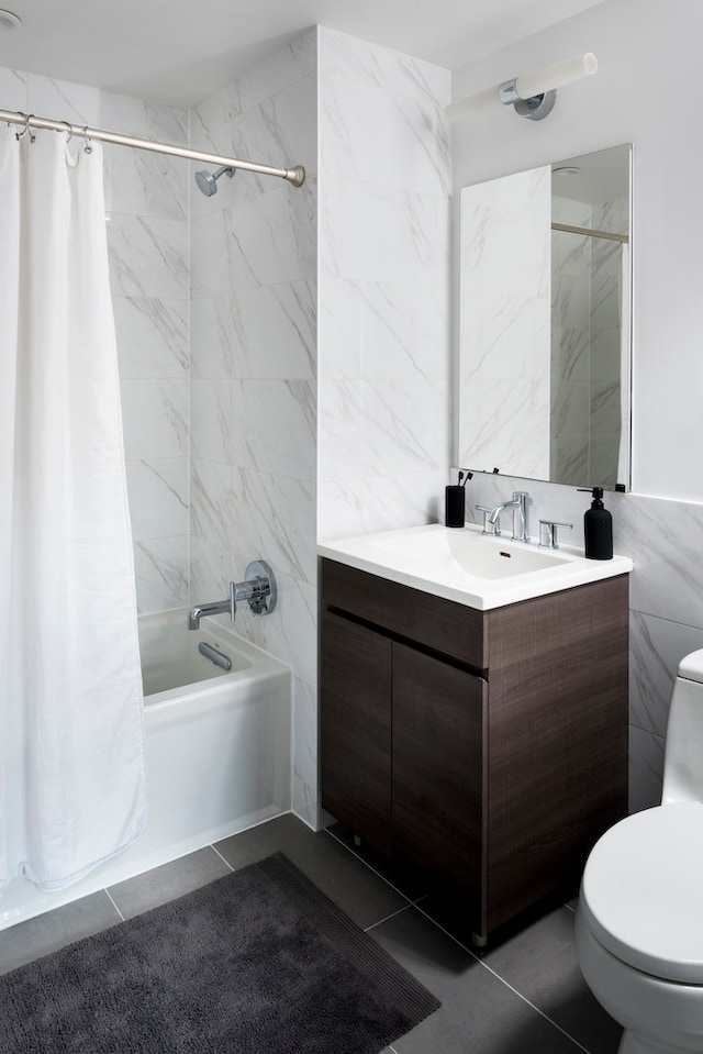 full bathroom with toilet, vanity, tile walls, tile patterned floors, and shower / bath combination with curtain