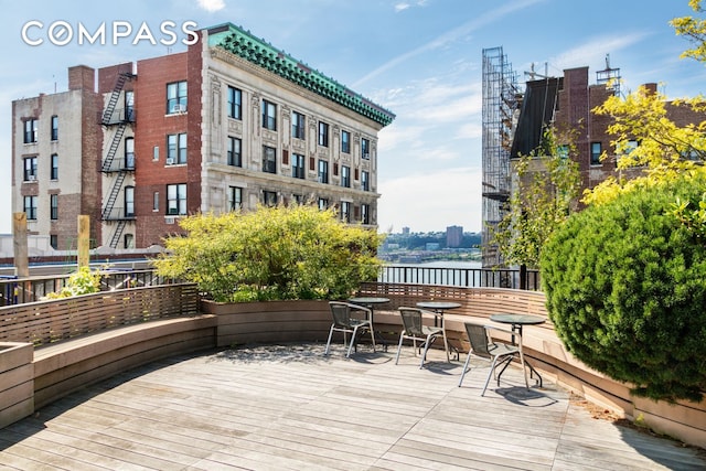 wooden terrace with a view of city