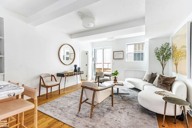 living room featuring baseboards and wood finished floors