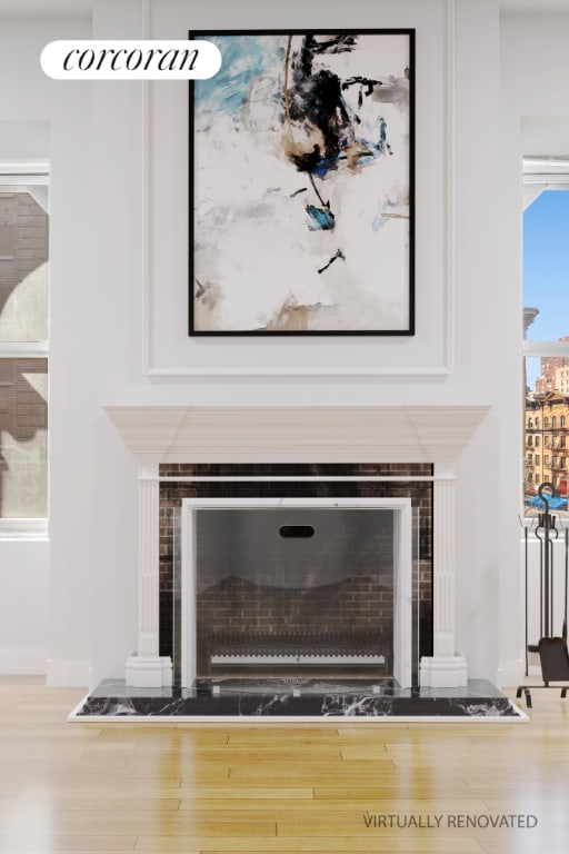 details with a premium fireplace and hardwood / wood-style floors