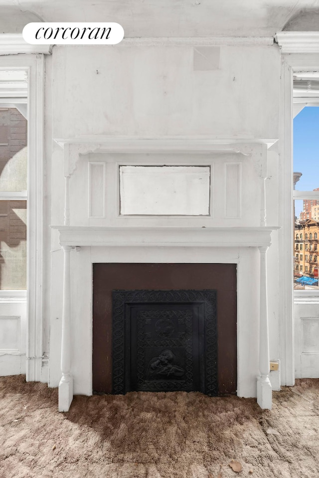 room details featuring carpet floors and a fireplace