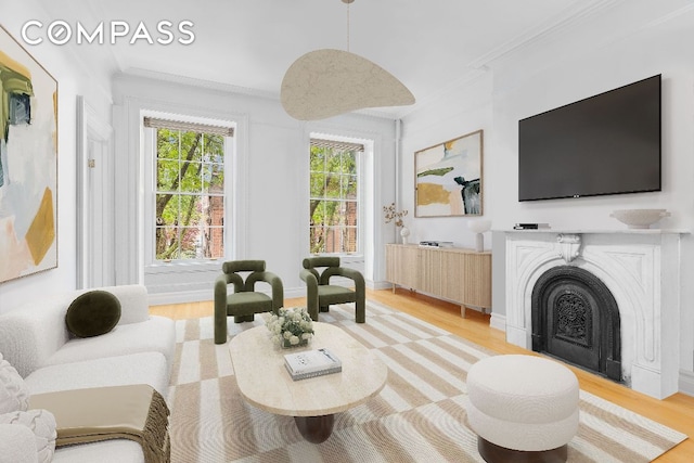 living room featuring ornamental molding and light hardwood / wood-style floors