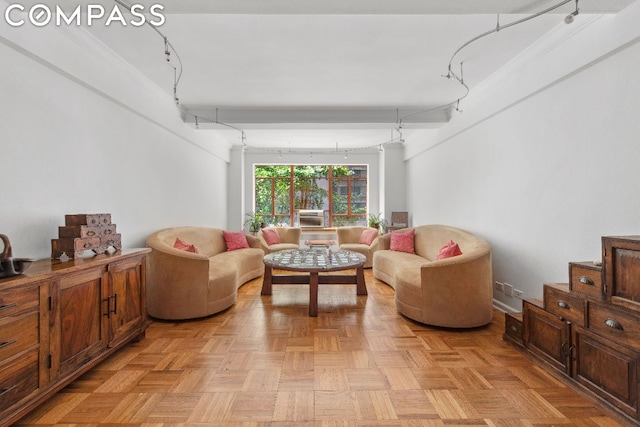 living room with ornamental molding and light parquet floors