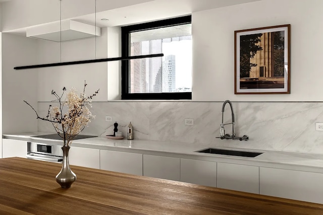 9 Chapel St Unit 8A, New York City, NY 11201 - bathroom with backsplash and a sink