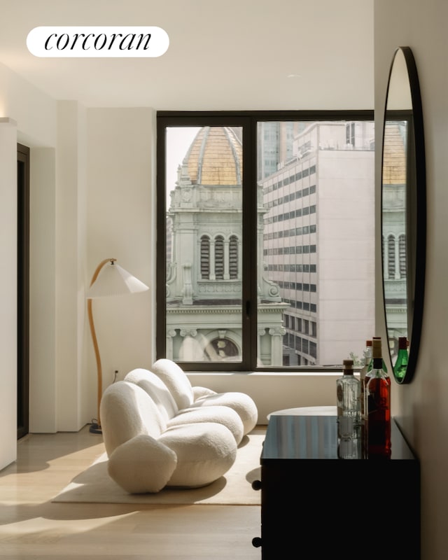 sitting room with light wood-style flooring