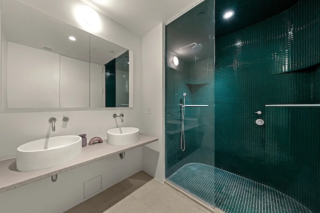 9 Chapel St Unit 8A, New York City, NY 11201 - full bathroom with a tile shower, visible vents, a sink, and double vanity
