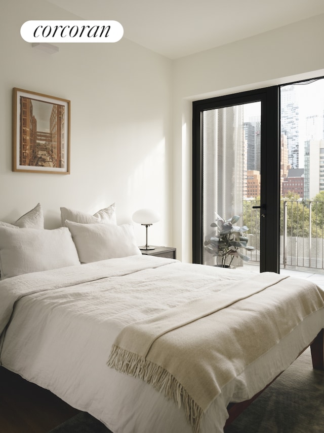 bedroom featuring a view of city and access to outside