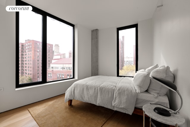 9 Chapel St Unit 8A, New York City, NY 11201 - bedroom featuring multiple windows and wood finished floors
