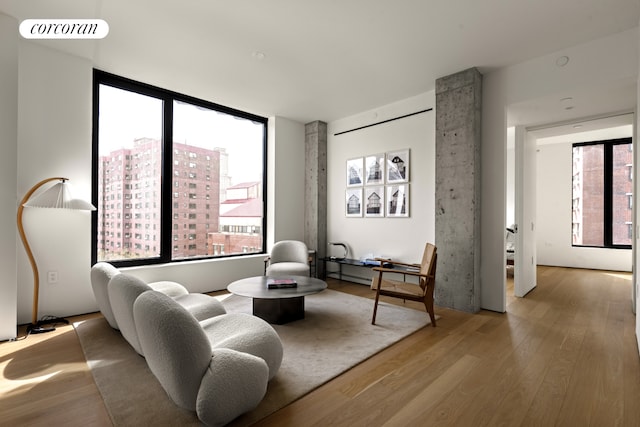 9 Chapel St Unit 8A, New York City, NY 11201 - sitting room with plenty of natural light, visible vents, and wood finished floors