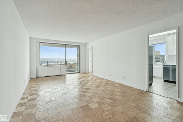 empty room featuring a textured ceiling