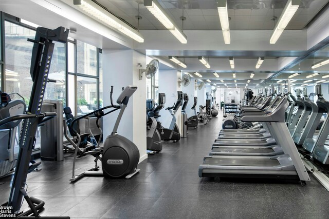 workout area featuring a drop ceiling