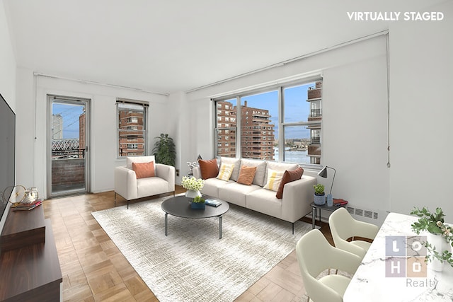 living room featuring light parquet floors