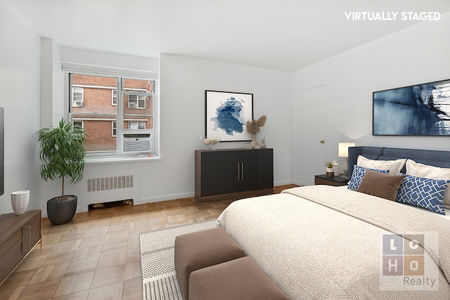 570 Grand St Unit H1504, New York City, NY 10002 - bedroom featuring radiator and baseboards