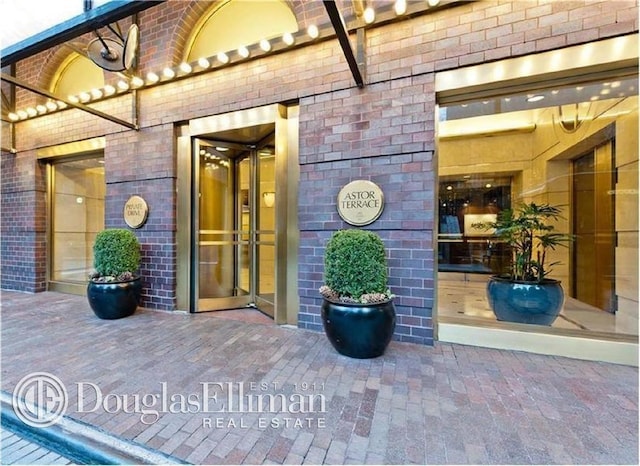 245 E 93rd St Unit 2E, New York City, NY 10128 - view of exterior entry with brick siding