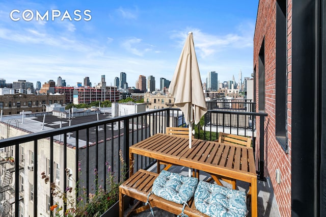 balcony featuring a view of city