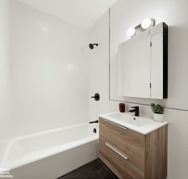 bathroom with shower / bathtub combination and vanity