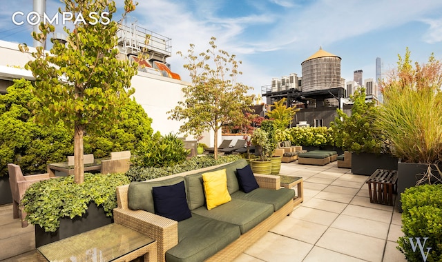 view of patio / terrace featuring a city view and an outdoor hangout area