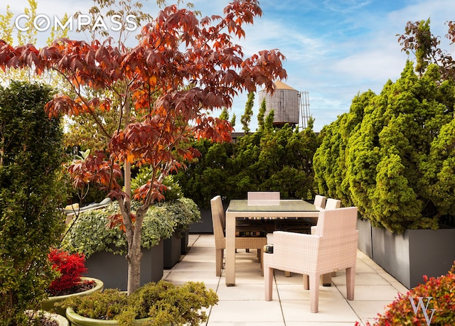 view of patio featuring outdoor dining area