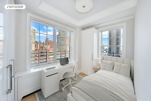 141 E 88th St Unit 10A, New York City, NY 10128 - bedroom with a city view, multiple windows, and built in desk