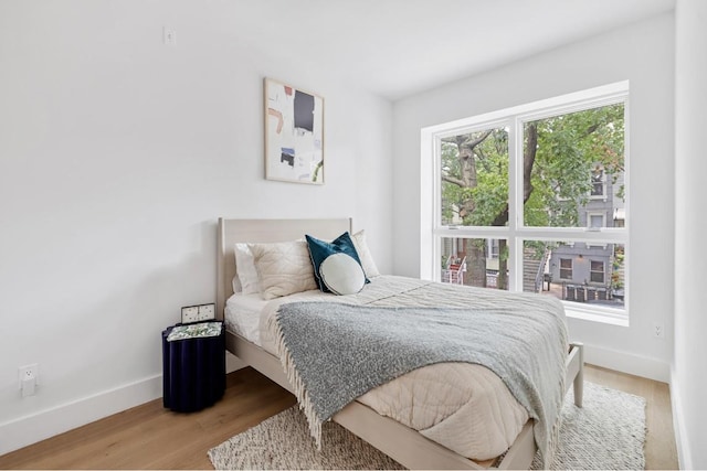 bedroom with wood-type flooring