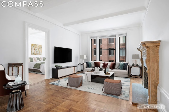 living room featuring light parquet flooring and beamed ceiling