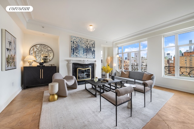 living room featuring crown molding and a premium fireplace