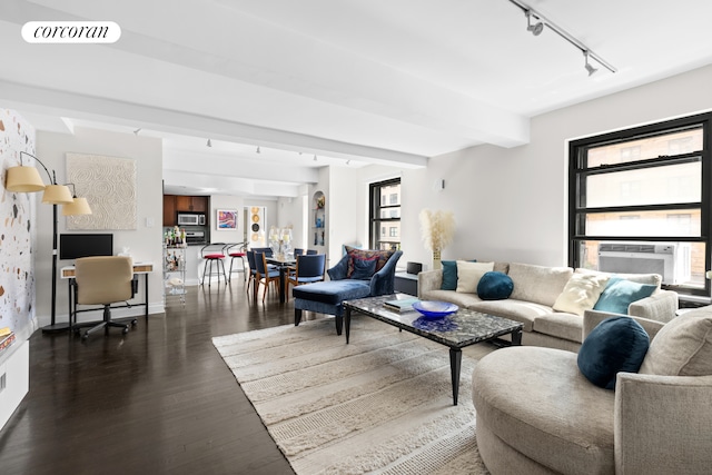 315 W 23rd St Unit 2C, New York City, NY 10011 - living area featuring track lighting, cooling unit, dark wood finished floors, beamed ceiling, and visible vents