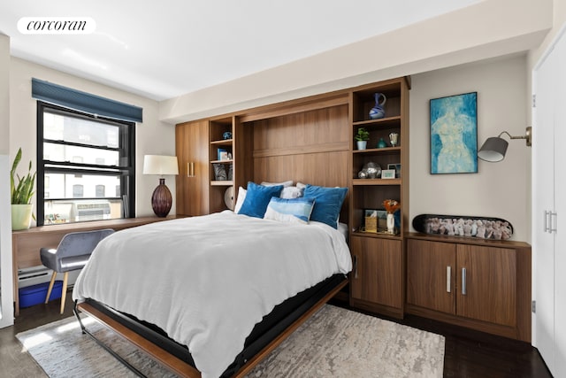 bedroom featuring dark hardwood / wood-style flooring