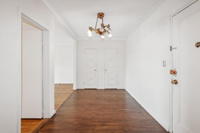 interior space with hardwood / wood-style flooring, radiator heating unit, ornamental molding, and ceiling fan